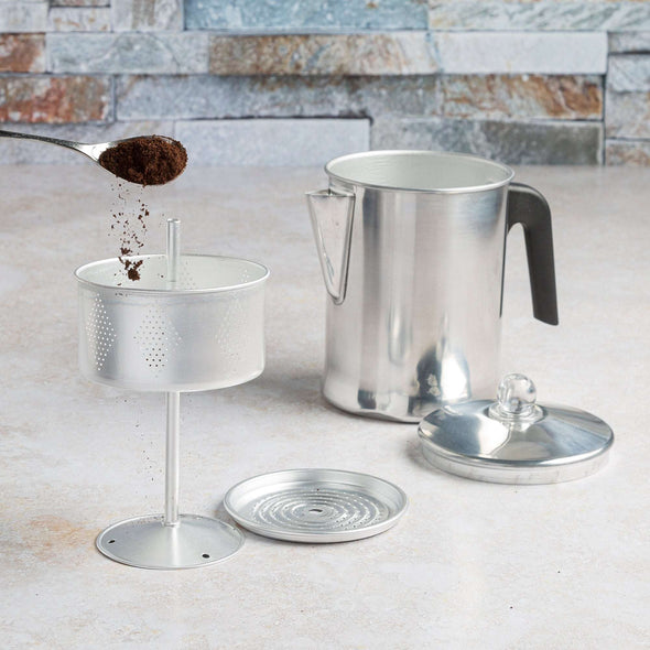Stovetop Coffee Percolator adding coffee grounds in filter