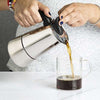 Stainless Steel Espresso Maker pouring coffee into mug