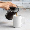 Tempo Coffee Press pouring coffee into mug on counter